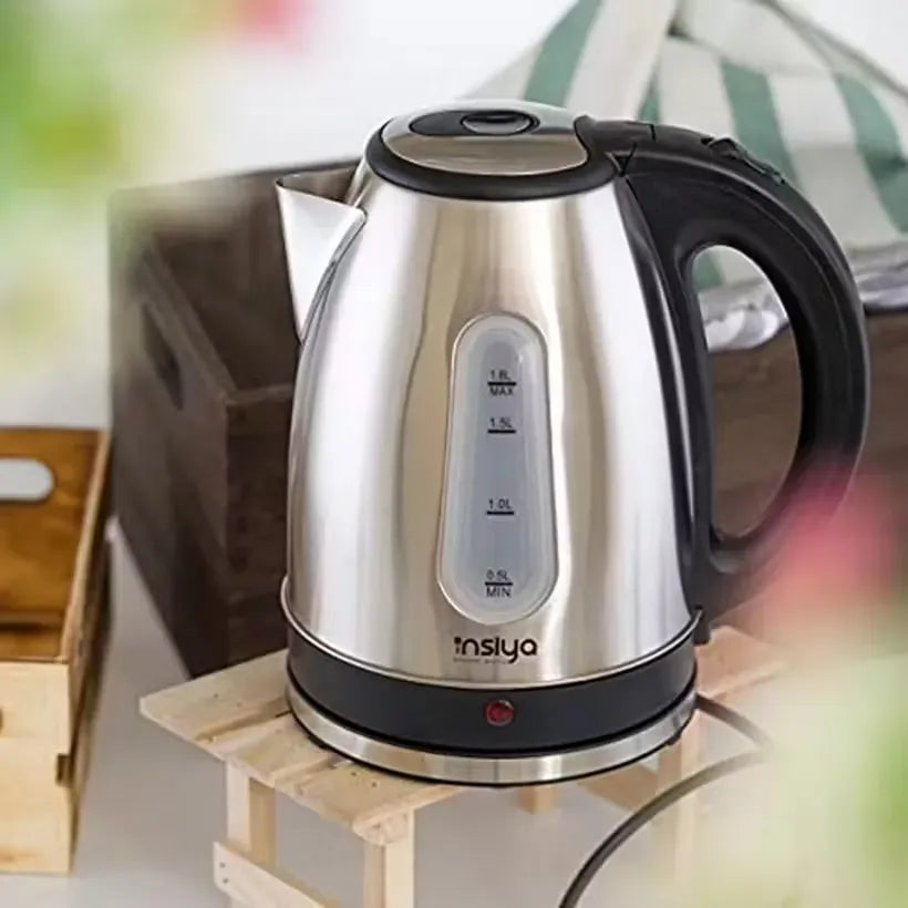 Insiya 1.8L electric kettle pouring water into a mug, highlighting its convenient spout and rapid boiling. Upgrade your kitchen with the stylish Insiya 1.8L electric kettle, featuring fast boiling and a premium design.